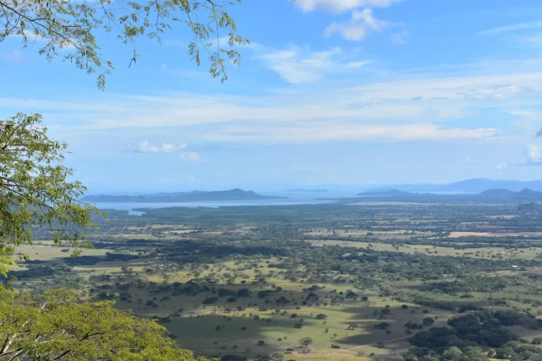 A view over the green plains and coastline of Costa Rica from the hills of Barra Honda National Park, Guanacaste.