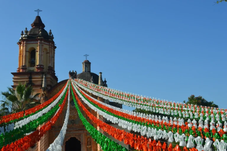Church decorated with green, white and red banners in Mexico