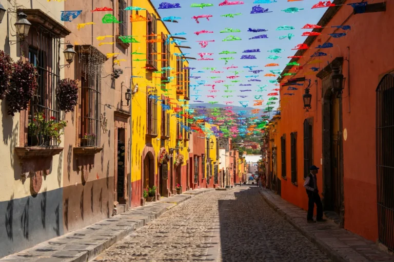 Colourful street with papel picado decorations in San Miguel de Allende, Mexico