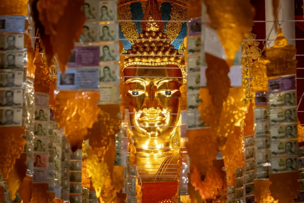 Golden Buddha statue inside a temple in Chiang Mai, Thailand