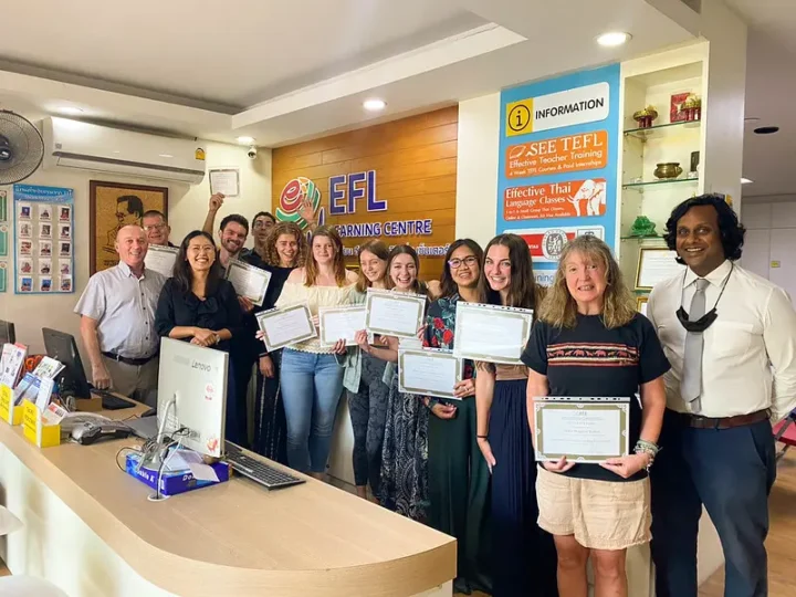 TEFL trainees holding their certificates in Chiang Mai, Thailand