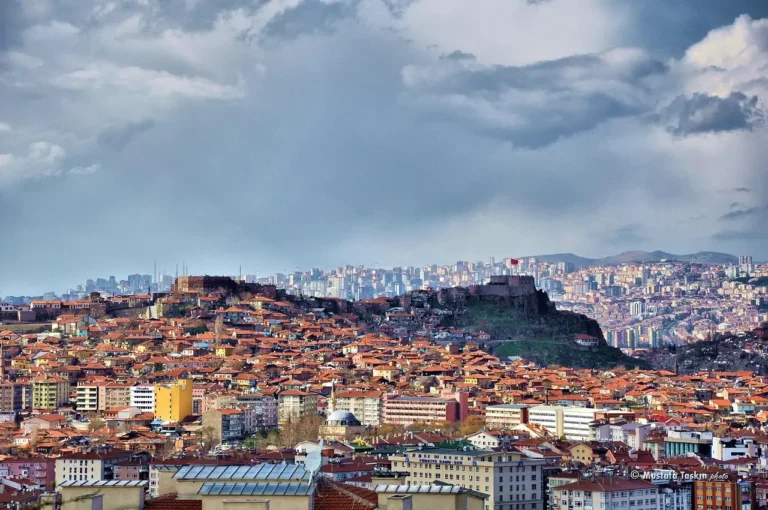 Ankara Castle above the red-tiled roofs of the old city, with modern Ankara rising behind.